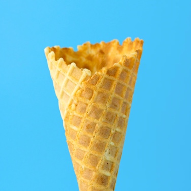 empty waffle cone with sky blue backgroun